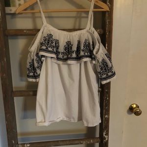 white shirt with navy embroidery